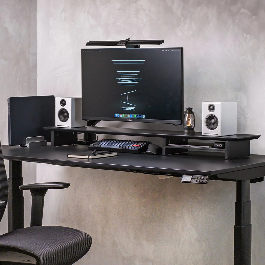 Omnidesk Arka desk riser black MDF on desk with monitor setup and storage space underneath