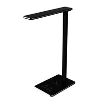 Omnidesk Spark Desk lamp with a rectangular base and a linear, sleek design. The lamp has a touch control panel on the base and adjustable light head.
